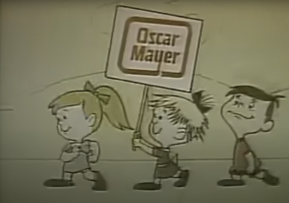 Animated children walk, one holding an "Oscar Mayer" sign. This image is likely from an old commercial