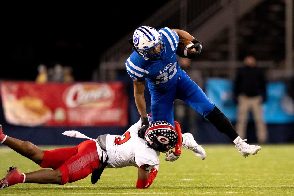 Cleveland Glenville defensive back Bryce West, shown tackling Wyoming running back C.J. Hester in the Division IV state final, is a nationally ranked football player.