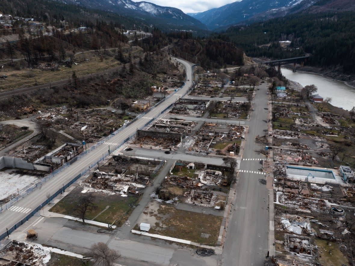 Burnt homes and vehicles are pictured in Lytton, B.C., nearly eight months after a wildfire swept through the village. As the community continues to rebuild, residents are heading to the polls Saturday to elect two new village councillors. (Gian Paolo Mendoza/CBC - image credit)