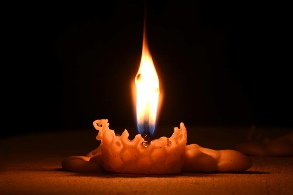 Candle burned very low with high flame.