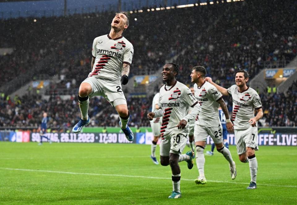 Alex Grimaldo of Bayer Leverkusen celebrates after scoring the team's third goal against Hoffenheim.