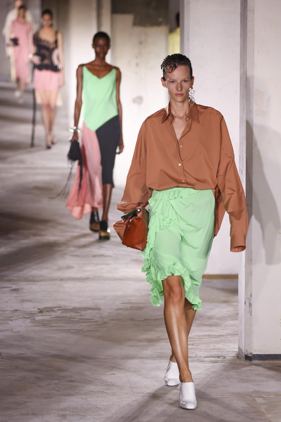 A model wears a creation for the Dries Van Noten ready-to-wear Spring/Summer 2023 fashion collection presented Wednesday, Sept. 28, 2022 in Paris. (Photo by Vianney Le Caer/Invision/AP)