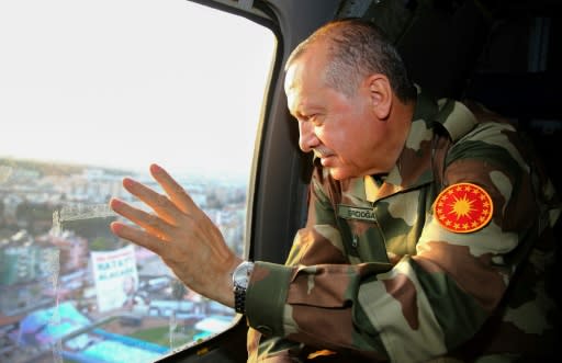 Turkish President Recep Tayyip Erdogan, seen here in military fatigues during an inspection of the border region on April 1, 2018, has threatened to crush Kurdish forces on both sides of the Euphrates river