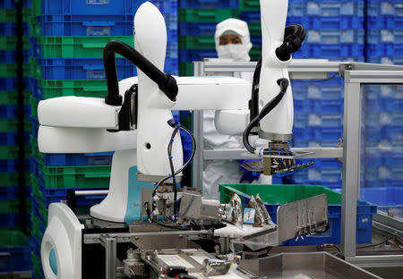 Kawasaki Heavy Industries' collaborative robot stacks rice balls at Delicious Cook &Co's food factory in Narashino, Japan, April 17, 2018. REUTERS/Toru Hanai