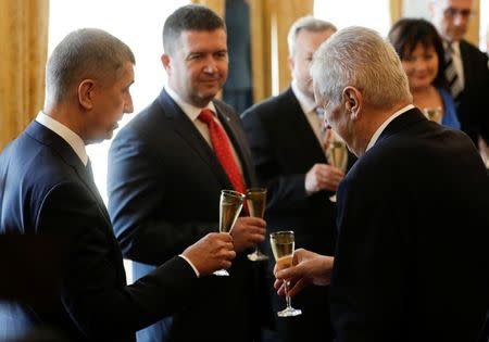 Czech President Milos Zeman, Prime Minister Andrej Babis and Czech Interior Minister Jan Hamacek make a toast during the cabinet's inauguration at Prague Castle in Prague, Czech Republic June 27, 2018. REUTERS/David W Cerny