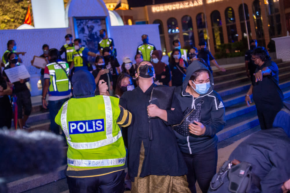 People were arrested during a candlelight vigil organised by activist movement #Lawan in remembrance of Covid-19 victims at Dataran Merdeka, August 19, 2021 — Picture by Shafwan Zaidon