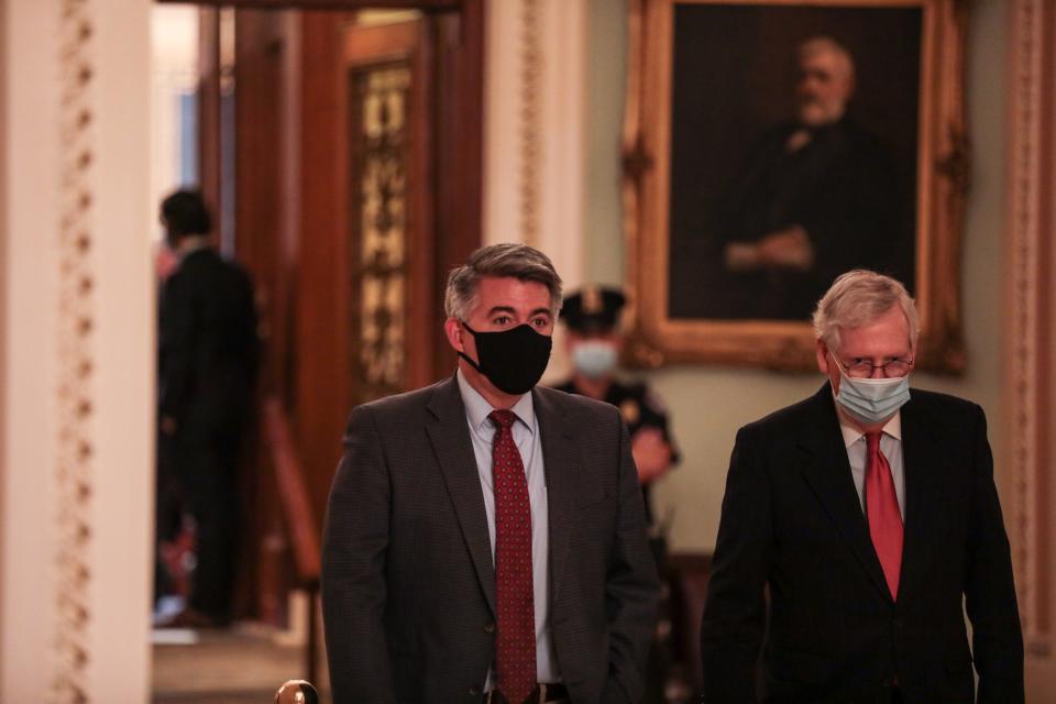 Sen. Cory Gardner (R-CO) talks to Senate Majority Leader Mitch McConnell (R-KY) after leaving the Senate Floor at the U.S. Capitol on December 21, 2020 in Washington, DC. The House and Senate approved a roughly $900 billion pandemic relief bill to bolster the U.S. economy.