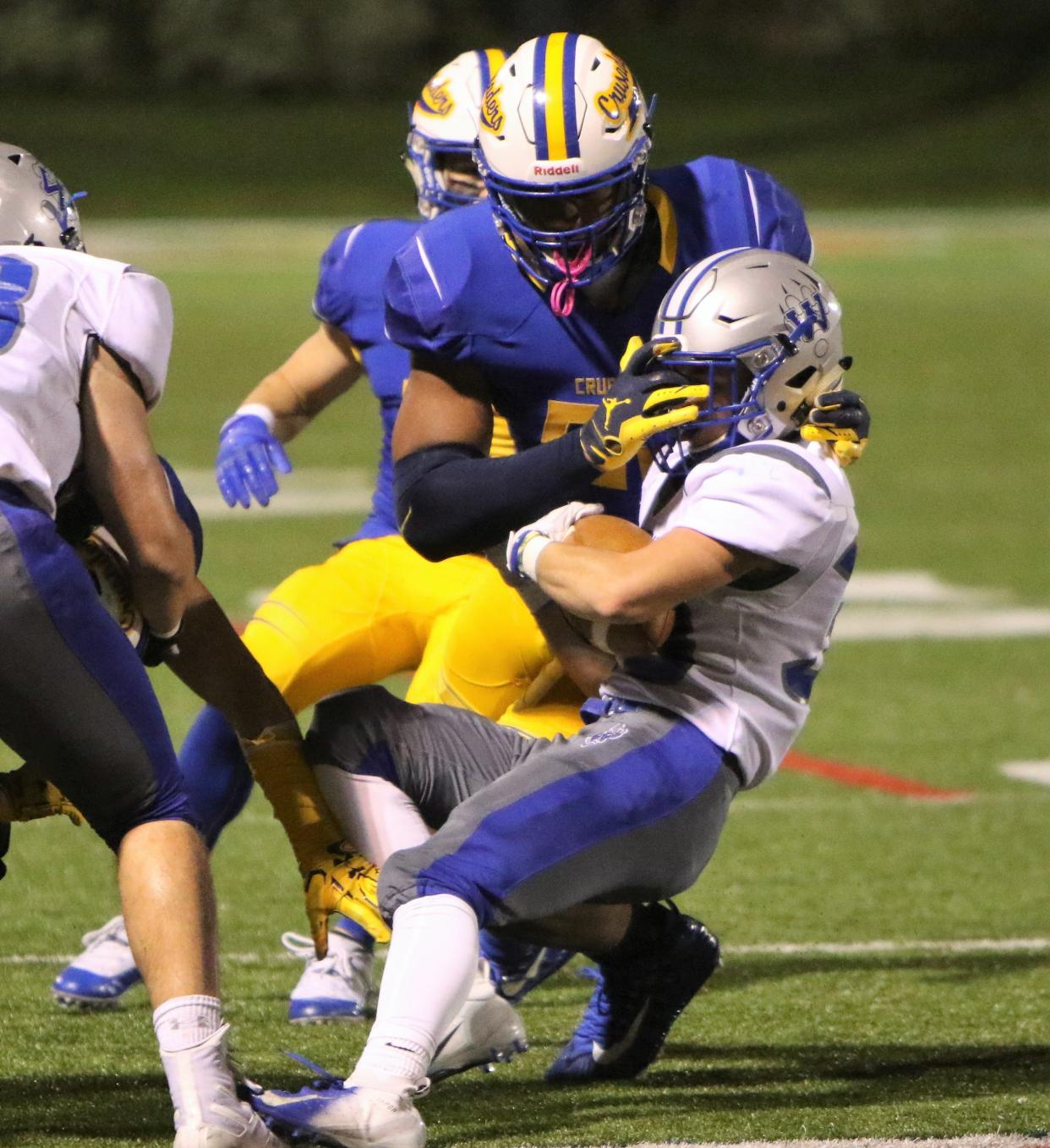 Catholic Memorial defensive lineman JC Latham makes a tackle against Waukesha West.