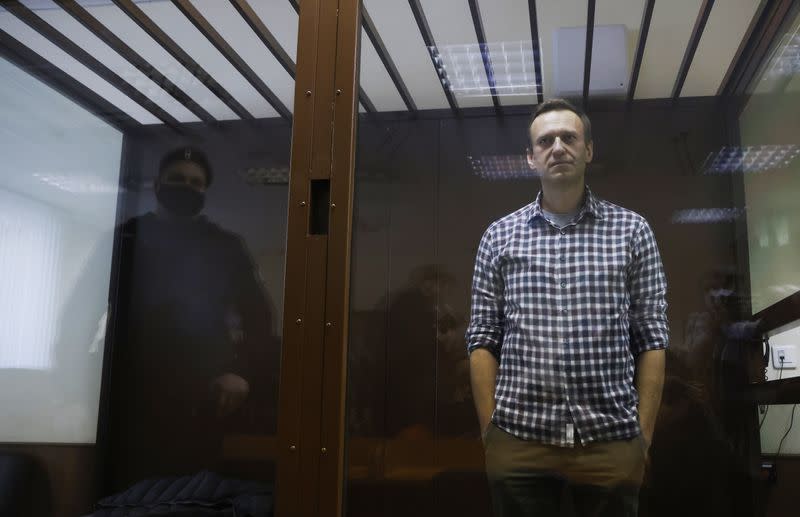 Russian opposition leader Alexei Navalny hearing to consider an appeal against an earlier court decision to change his suspended sentence to a real prison term