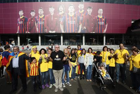 Catalan separatists form a human chain to mark the "Diada de Catalunya" (Catalunya's National Day) in front of the Nou Camp stadium in Barcelona September 11, 2013. REUTERS/Gustau Nacarino