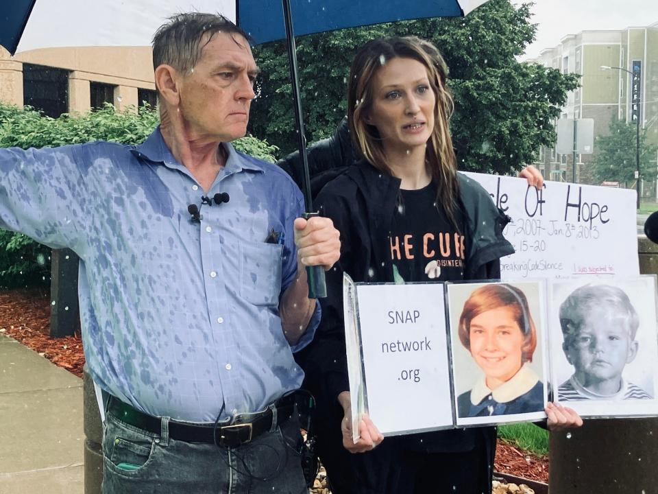 Braving Tuesday's pouring rain, Amanda Householder, right, was among the three women who have urged Missouri Attorney General's Office to step in to help prevent similar abuse at Missouri boarding schools.