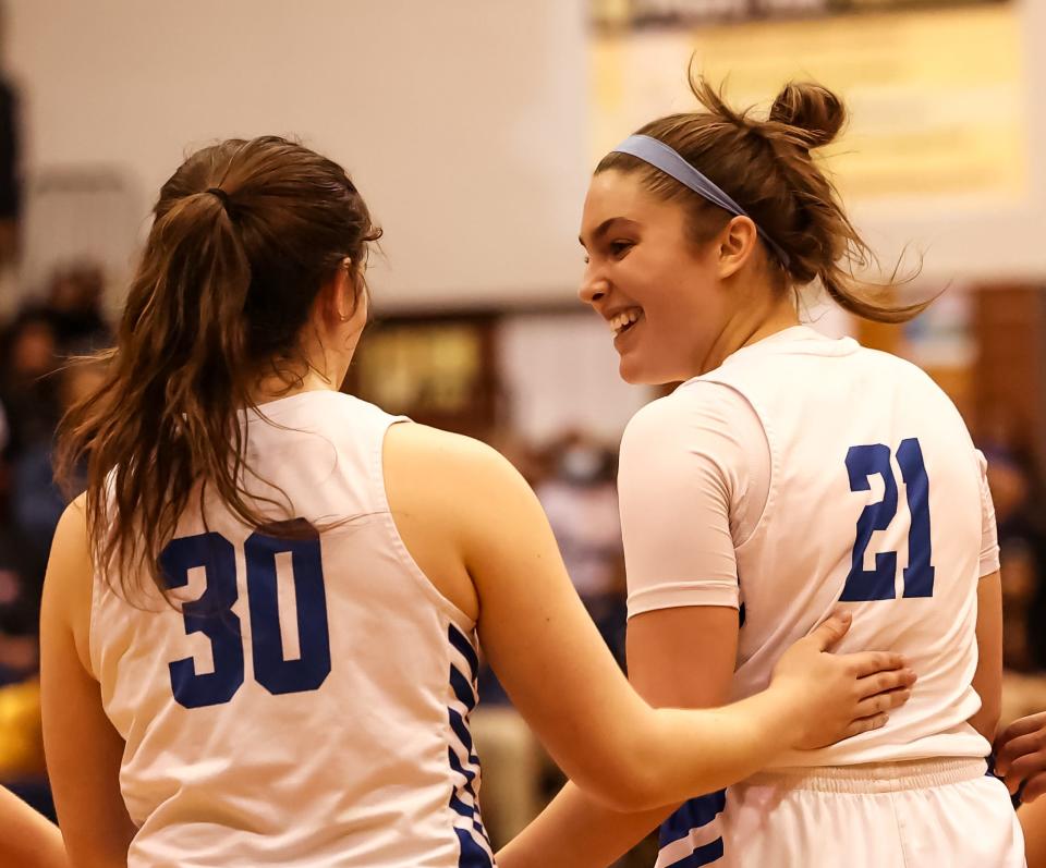 Chippewa's Jaclyn Jundzilo (30) and Annabel Rodriguez (21) share a smile late in their win as Rodriguez was fouled on the play and headed to the free throw line.
