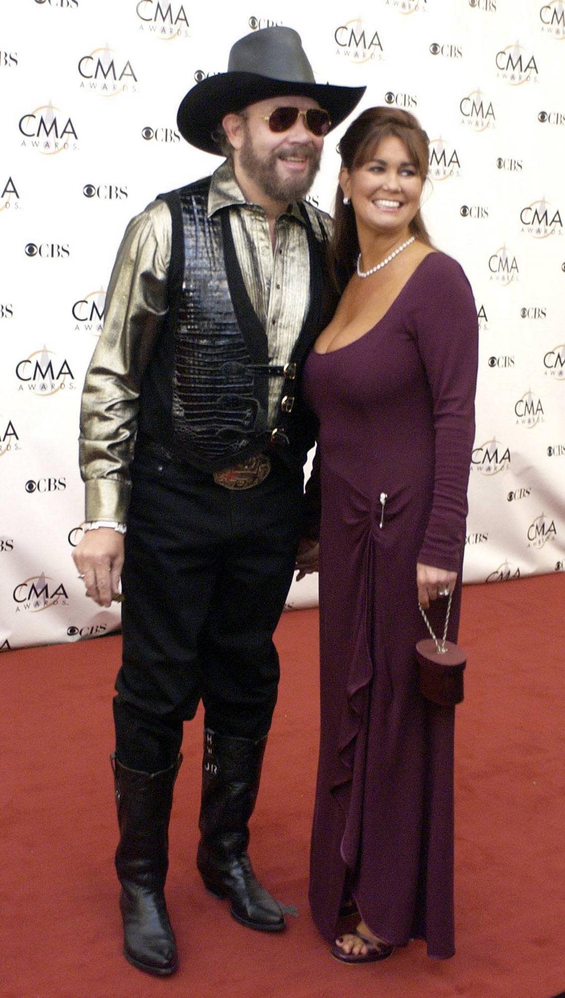 Hank Williams Jr. and his wife, Mary Jane, arrive for the 37th annual Country Music Association Awards show in Nashville, Tenn. in a Wednesday, Nov. 5, 2003 photo. Hank Williams Jr. has filed for divorce from his wife of 16 years, Mary Jane, saying she has a problem with addiction, he said in a statement Friday.