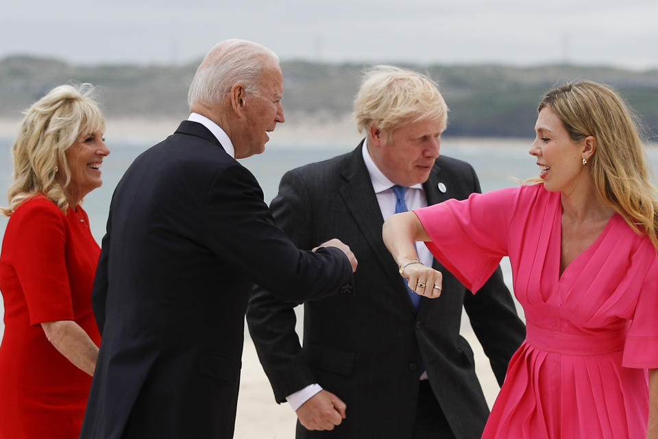 Britain's Prime Minister Boris Johnson and his spouse Carrie Johnson greet U.S. President Joe Biden and first lady Jill Biden during arrivals for a G7 meeting at the Carbis Bay Hotel in Carbis Bay, St. Ives, Cornwall, England, Friday, June 11, 2021. Leaders of the G7 begin their first of three days of meetings on Friday, in which they will discuss COVID-19, climate, foreign policy and the economy. (Phil Noble, Pool via AP)