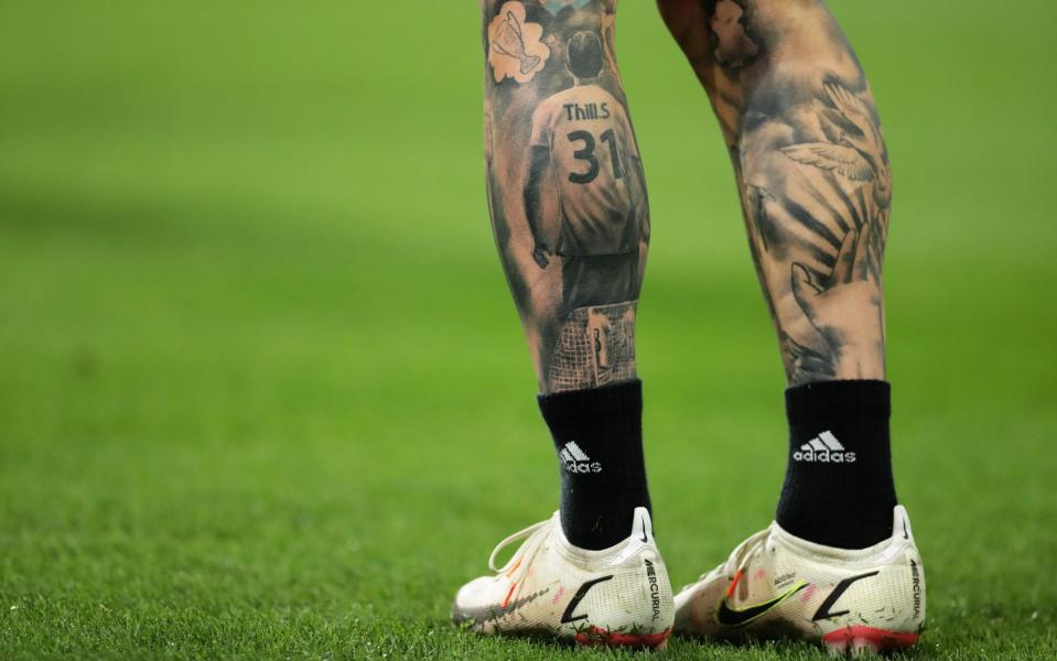 Thill has a tattoo on his leg setting out his big dream of playing in the Champions League - /GETTY IMAGES 