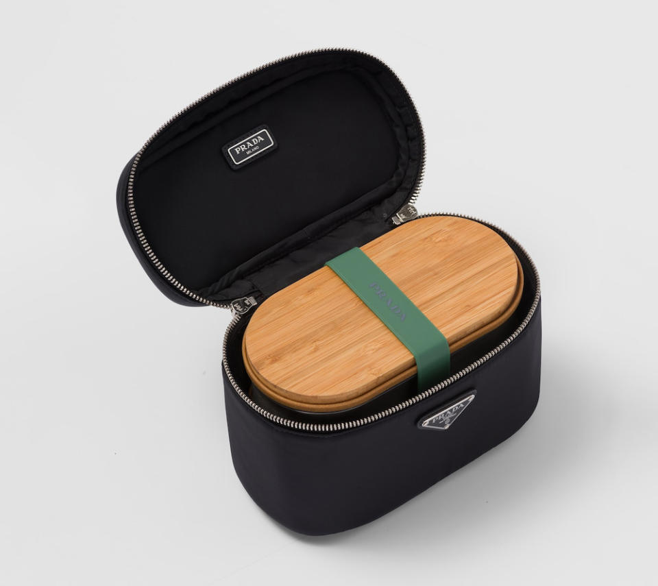 Now you can eat your lunch at your desk in style with a lunchbox from Prada. Prada