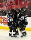 LOS ANGELES, CA - JUNE 11: Willie Mitchell #33, Anze Kopitar #11 and Slava Voynov #26 of the Los Angeles Kings celebrate with teammate Jeff Carter #77 of the Los Angeles Kings after Carter scored in the second period of Game Six of the 2012 Stanley Cup Final against the New Jersey Devils at Staples Center on June 11, 2012 in Los Angeles, California. (Photo by Bruce Bennett/Getty Images)