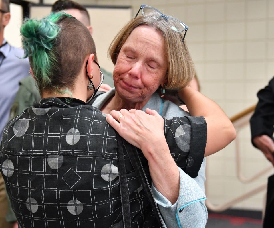 New College of Florida President Patricia Okker hugs New College alum X Gonzalez following the Board of Trustees meeting Tuesday in Sarasota.  The Board voted to fire Okker without cause. 