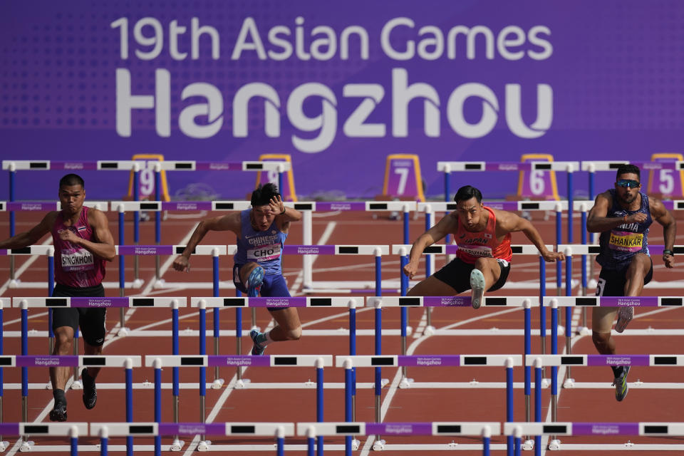 From left, Thailand's Suttisak Singkhon, Taiwan's Cho Chia-Hsuan, Japan's Yuma Maruyama and India's Tejaswin Shankar compete during the men's decathlon 110-meter hurdles at the 19th Asian Games in Hangzhou, China, Tuesday, Oct. 3, 2023. (AP Photo/Aaron Favila)