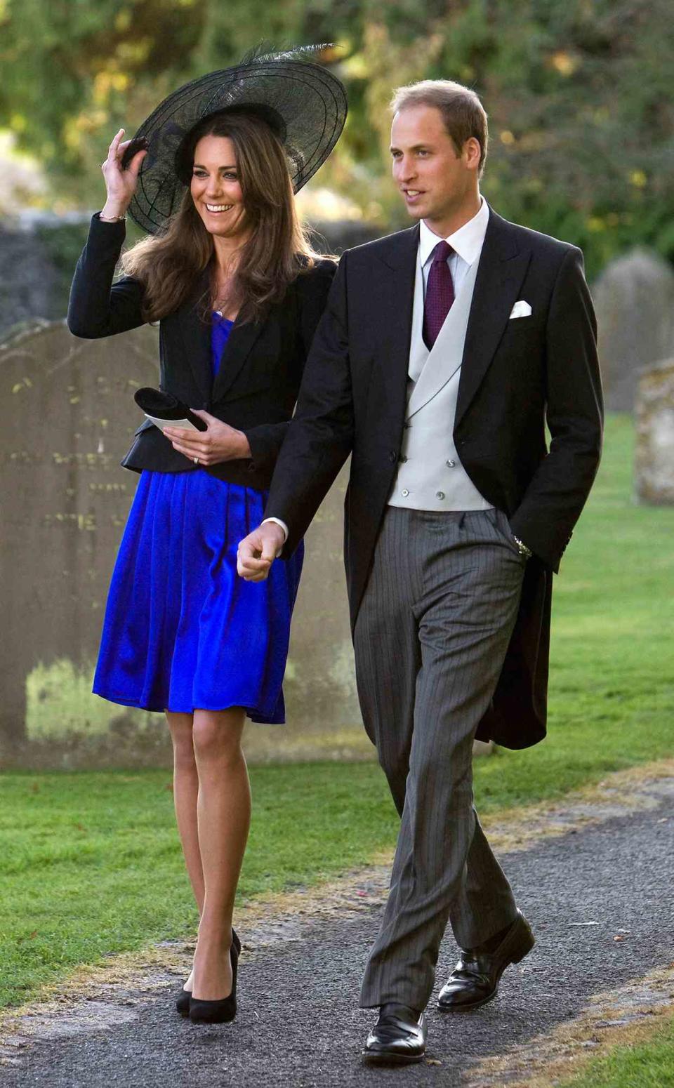 Prince William and Kate Middleton leave the wedding of their friends Harry Mead and Rosie Bradford in the village of Northleach, Gloucestershire.