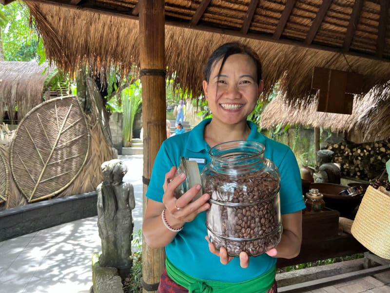 A Balinese woman holds a glass of Luwak coffee, probably the most expensive coffee in the world. Carola Frentzen/dpa