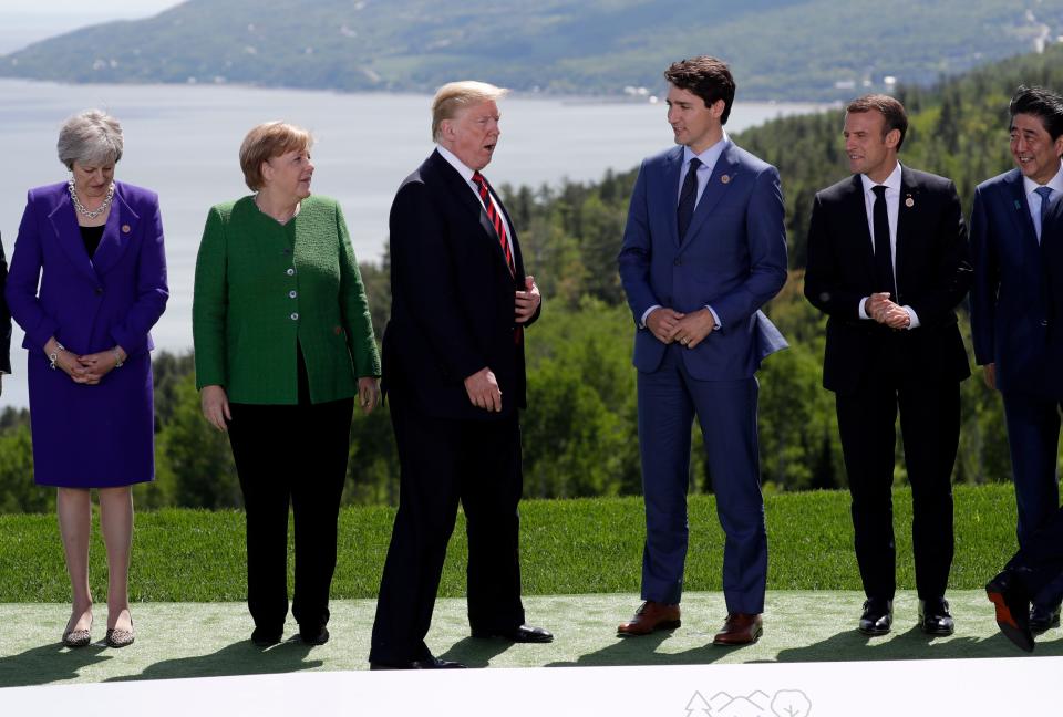 From left to right, British Prime Minister Theresa May, German Chancellor Angela Merkel, President Trump, Canadian Prime Minister Justin Trudeau, French President Emmanuel Macron, Japanese Prime Minister Shinzo Abe gather for a photo at the G-7 summit.