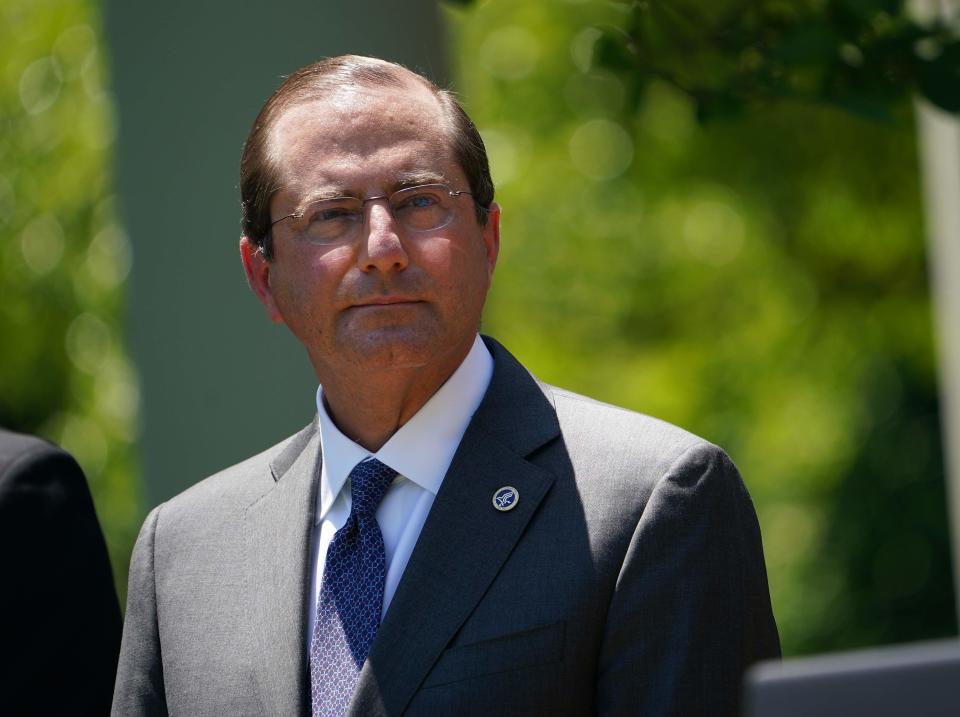 Secretary of Health and Human Services Alex Azar listens during a vaccine development announcement on May 15, 2020, in the Rose Garden of the White House.