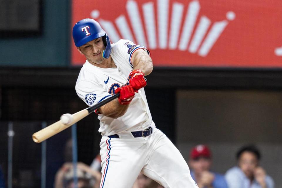 Texas Rangers designated hitter Wyatt Langford (36) swings at a pitch at the bottom of the tenth inning of their season opener against the Chicago Cubs at Globe Life Field in Arlington on Thursday, March 28, 2024. Chris Torres/ctorres@star-telegram.com