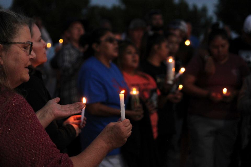 Community members gather for a prayer vigil at Hills Church on Monday in Farmington, N.M.