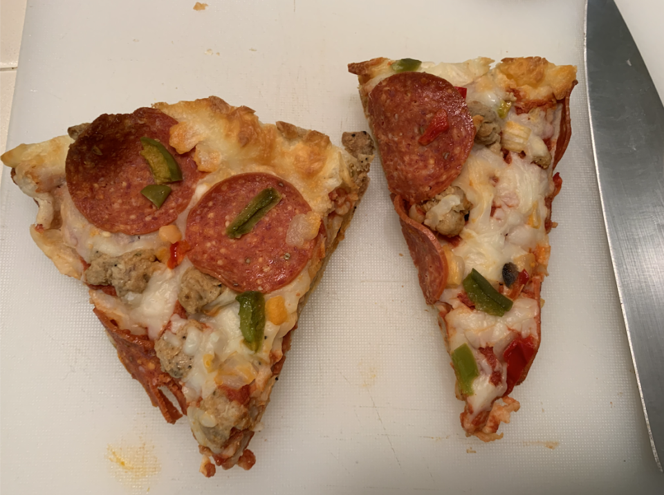 I cut the crusts off my pizza to avoid scrambled bites of just egg and crust. (Samantha Kubota / TODAY)