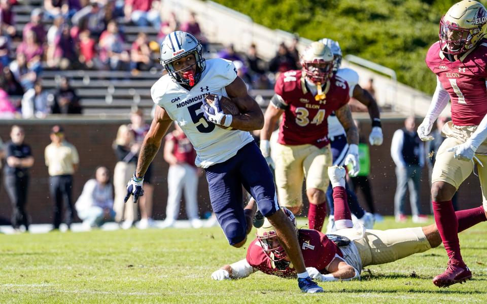 Monmouth's Dymere Miller picked up yardage after a catch against Elon on Oct. 21, 2023 in Elon, N.C.