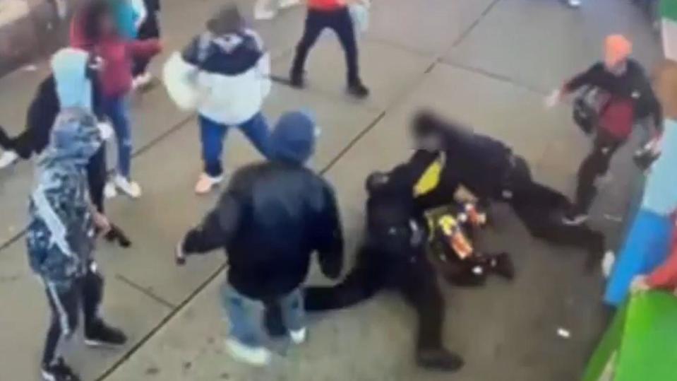 PHOTO: 5 asylum-seekers are pictured in an encounter with police officers in Times Square on Jan. 27, 2024. (NYPD Crime Stoppers)