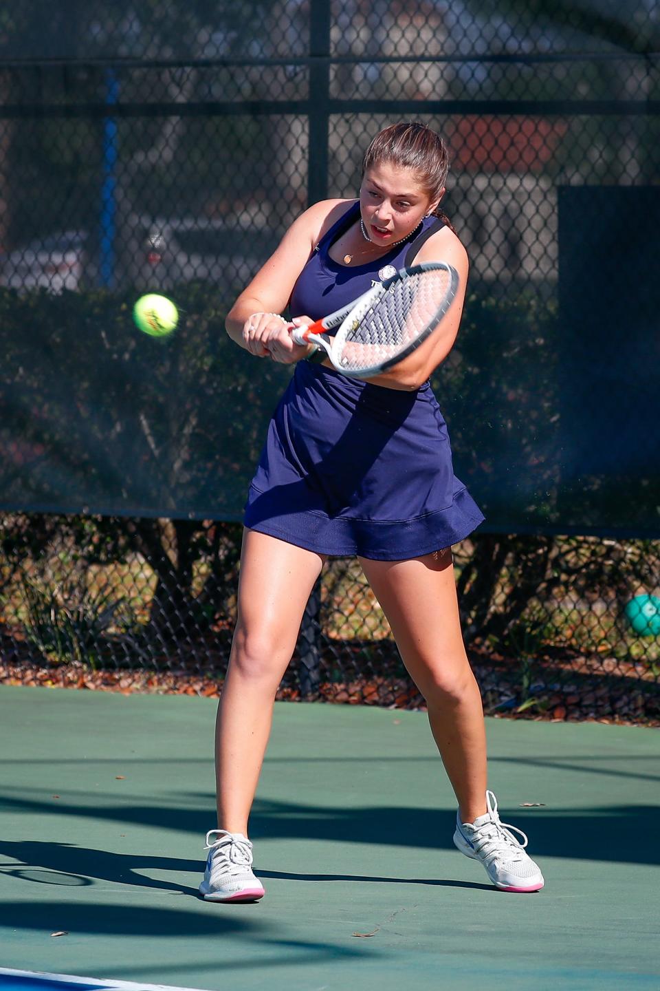 Bolles School junior Violet Robbins, the Times-Union's All-First Coast player of the year, returns a serve during a high school girls tennis match in April 2022. [Jeff Adams/For Bolles School Athletics]