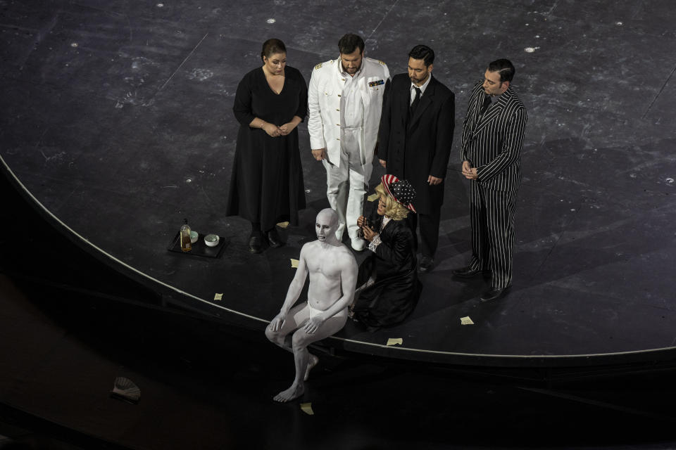 From left to right second row, Russian mezzo-soprano Maria Kolosova, Italian tenor Andrea Care, Greek baritone Dionisios Sourbis, Greek tenor Yannis Kalyvas and Korean soprano Anna Sohn, first row right perform the "Madame Butterfly" at the Odeon of Herodes Atticus in Athens, on Thursday, June 1, 2023. The annual arts festival in Athens and at the ancient theater of Epidaurus in southern Greece is dedicated this year to the late opera great Maria Callas who was born 100 years ago. (AP Photo/Petros Giannakouris)