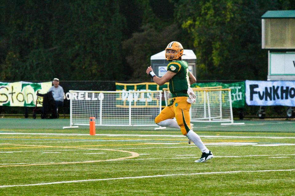 Blackhawk sophomore quarterback Stephen Knallay races home for a touchdown during the Cougars' 31-14 win over Ambridge in Week 3.