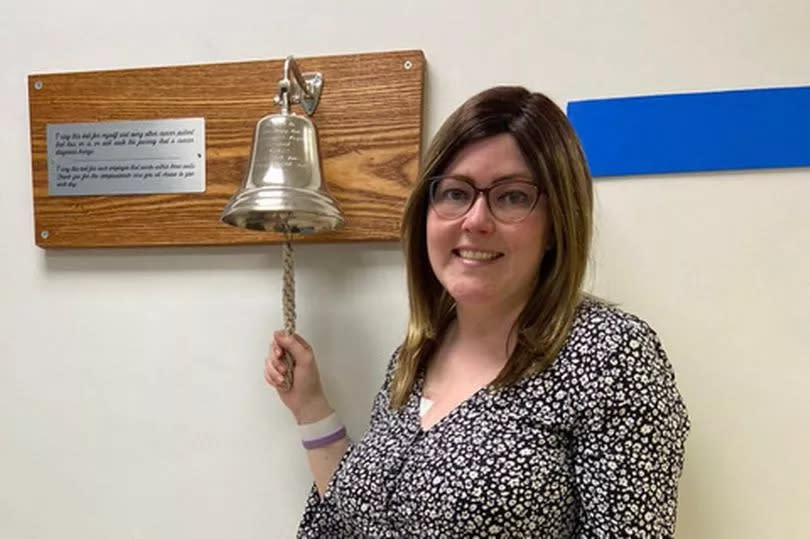 Catherine Walker, 28, rings the bell at hospital marking her cancer recovery