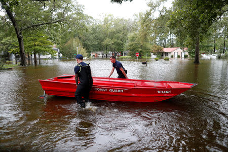 U.S. Coast Guard personnel prepare to patrol floodwaters during Tropical Storm Florence in Lumberton, North Carolina, U.S. September 16, 2018. REUTERS/Randall Hill