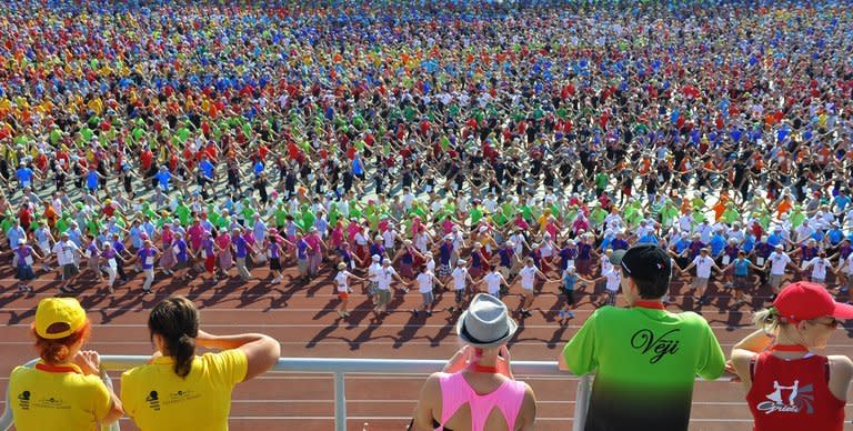 Dancers are seen during a rehearsal for the Song and Dance festival in Riga, Latvia, on July 4, 2013. Nearly 40,000 people or two percent of Latvia's population take to the stage -- a per capita equivalent of one million singers and dancers in France