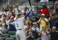 Los Angeles Dodgers' Freddie Freeman reacts to a standing ovation as he takes his first at-bat during the first inning of a baseball game against the Atlanta Braves, Sunday, June 26, 2022, in Atlanta. (AP Photo/Bob Andres)