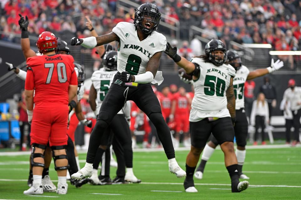 Hawaii defensive back Eugene Ford (8) reacts after Hawaii recovered a fumble by UNLV during the first half of an NCAA college football game Saturday, Nov. 13, 2021, in Las Vegas. (AP Photo/David Becker)