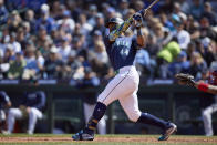 Seattle Mariners' Julio Rodríguez swings through hitting a double against the Atlanta Braves during the seventh inning of a baseball game, Wednesday, May 1, 2024, in Seattle. The Braves won 5-2. (AP Photo/John Froschauer)