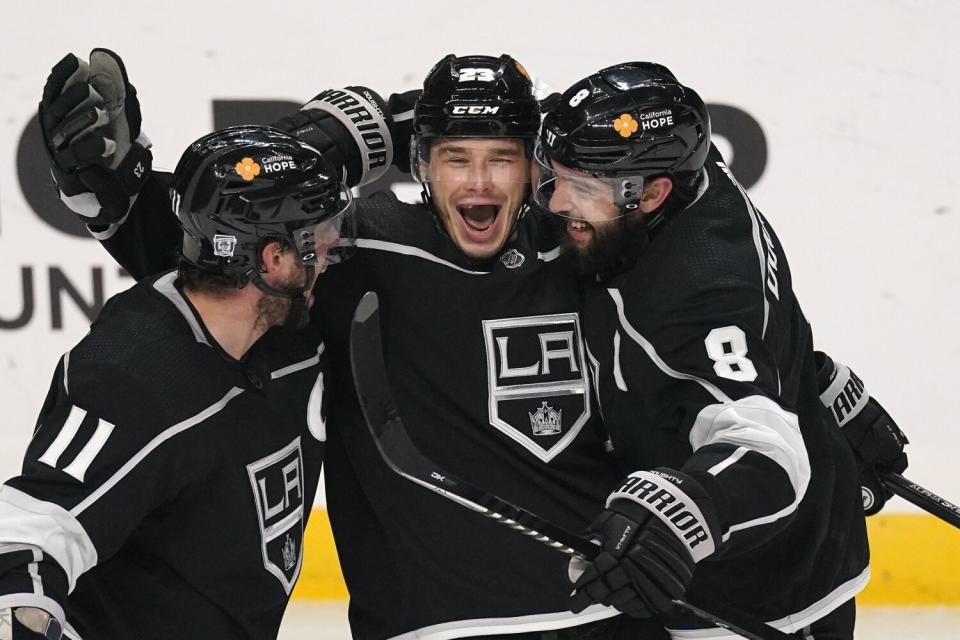 Los Angeles Kings right wing Dustin Brown, center, celebrates his goal against the Minnesota Wild on Feb. 16,2021.