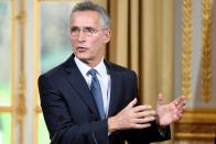 NATO Secretary General Jens Stoltenberg takes part in a news conference with French President Emmanuel Macron after their meeting at the Elysee palace in Paris