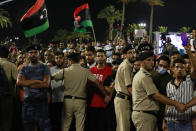 Hundreds of demonstrators protest in Tripoli, Libya, on Friday, Sept. 24, 2021, in opposition to the country’s parliament passing a vote of no-confidence in the transitional government. The motion, passed on Tuesday, represents a challenge to planned December elections and impedes efforts to unite the oil-rich North African nation after a decade of turmoil. (AP Photo/Yousef Murad)