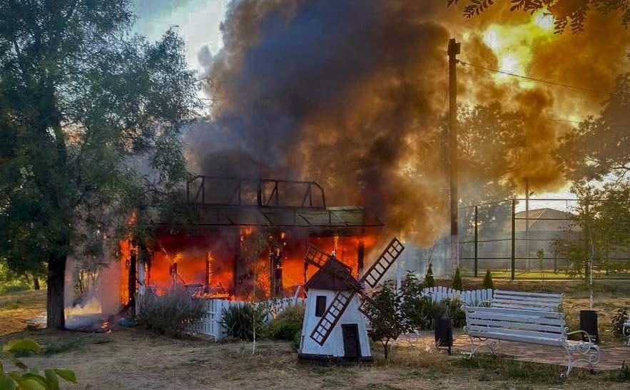 A burning children's cafe hit by a Russian military strike, amid Russia's attack on Ukraine, in the village of Malokaterynivka, Zaporizhzhia region