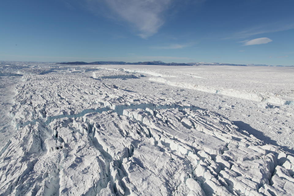 Giant icebergs detaching from the front of Zachariæ Isstrøm, whose floating ice tongue collapsed in 2003. The ice discharge into the ocean from this glacier has dramatically increased since then.  / Credit: Anders Bjørk, August 2016