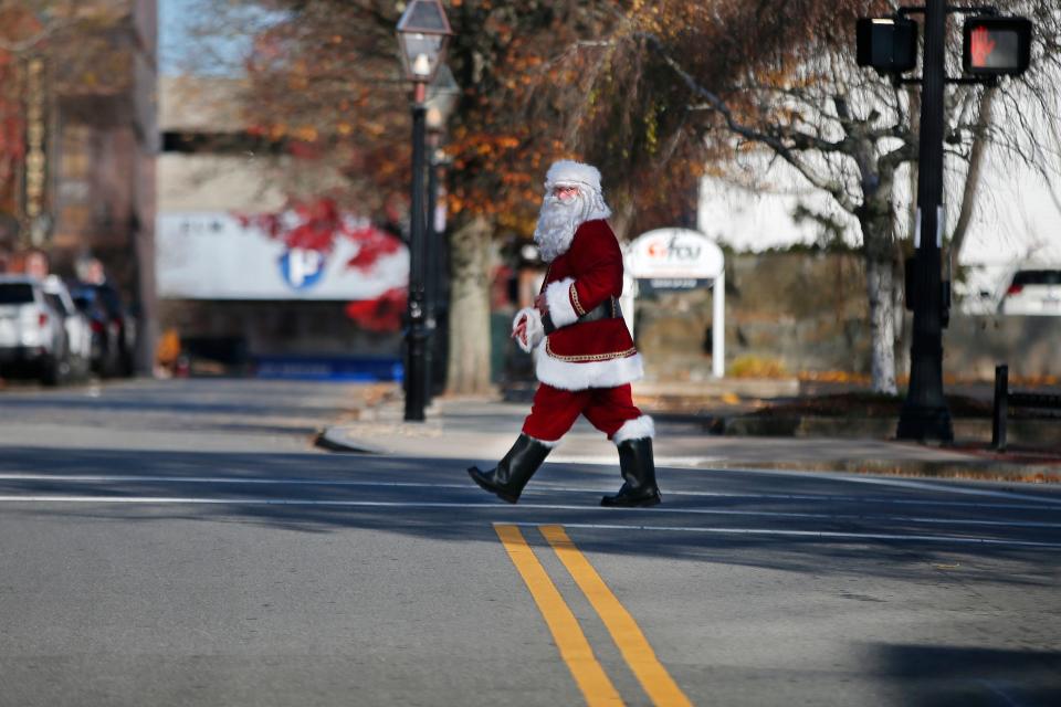 Santa Claus makes an early visit to downtown New Bedford as he makes his way up Union Street.