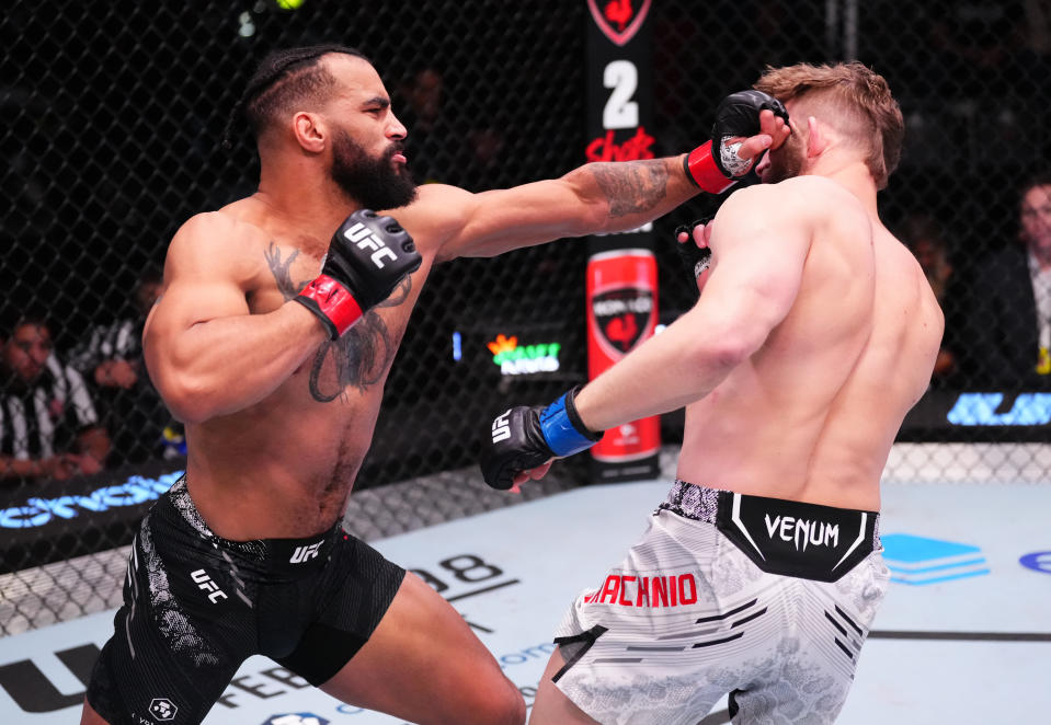 LAS VEGAS, NEVADA – FEBRUARY 10: (L-R) Devin Clark punches Marcin Prachnio of Poland in a light heavyweight fight during the UFC Fight Night event at UFC APEX on February 10, 2024 in Las Vegas, Nevada. (Photo by Jeff Bottari/Zuffa LLC via Getty Images)