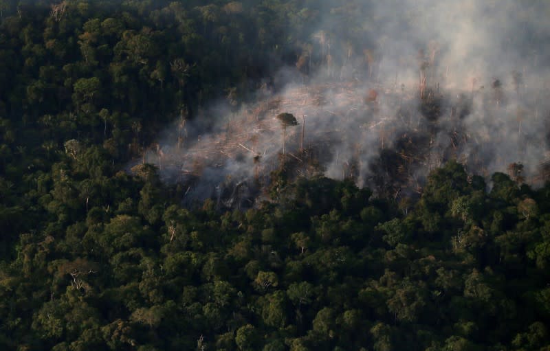 FILE PHOTO: An aerial view of a tract of Amazon jungle burning as it is cleared by farmers in Itaituba