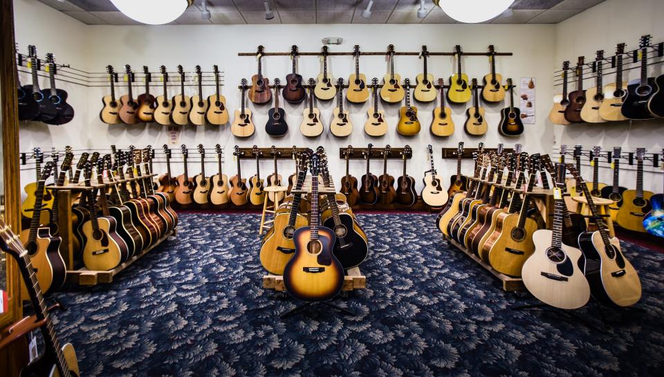 The legendary acoustic  guitar room at Elderly Instruments in Lansing, which featuring a wide-array of some of their high-end custom acoustic guitars, seen Friday, July 1, 2022. Elderly celebrates 50 years in Lansing on July 5.